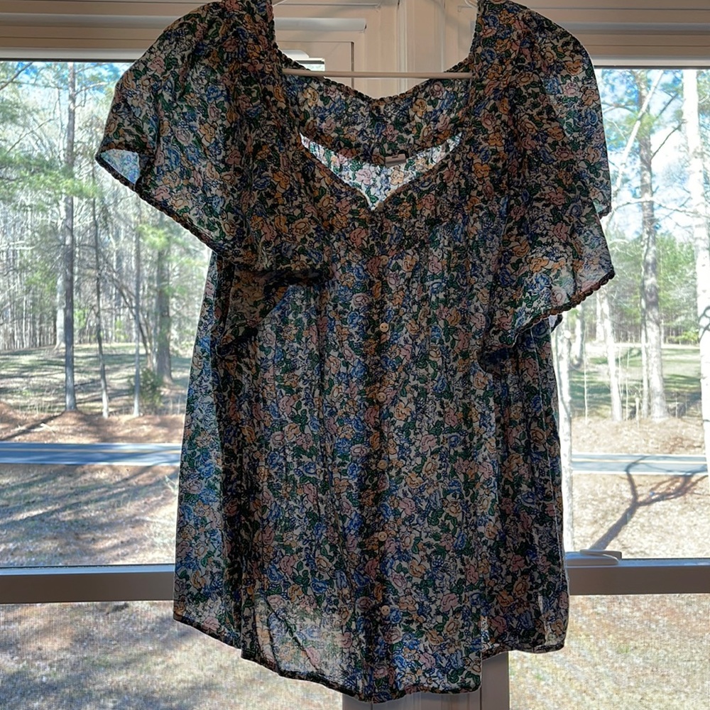 Light colored floral blouse